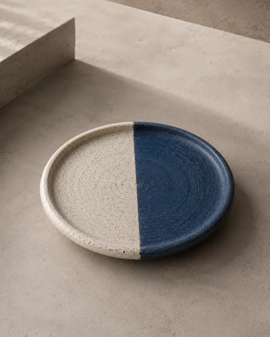 Plate half in speckled cream, half in deep blue